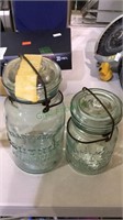 Two old lightening brand mason jars, aqua glass.