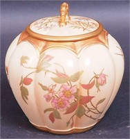 A Royal Worcester biscuit jar decorated with
