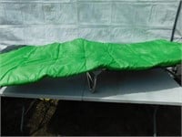 Coleman cot + sleeping bag with small cache pocket