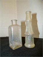 2 vintage iridescent colored glass bottles