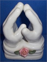 small praying hands statue