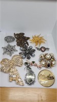 11 various brooches