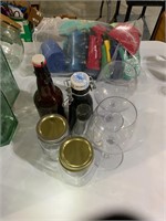 lot jars, bottles and plastic wine glasses