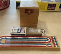 Cribbage board, decks of cards and a mysterious
