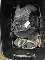 Tote of assorted shoes.