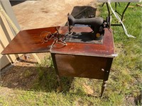 Vintage Singer sewing machine and cabinet