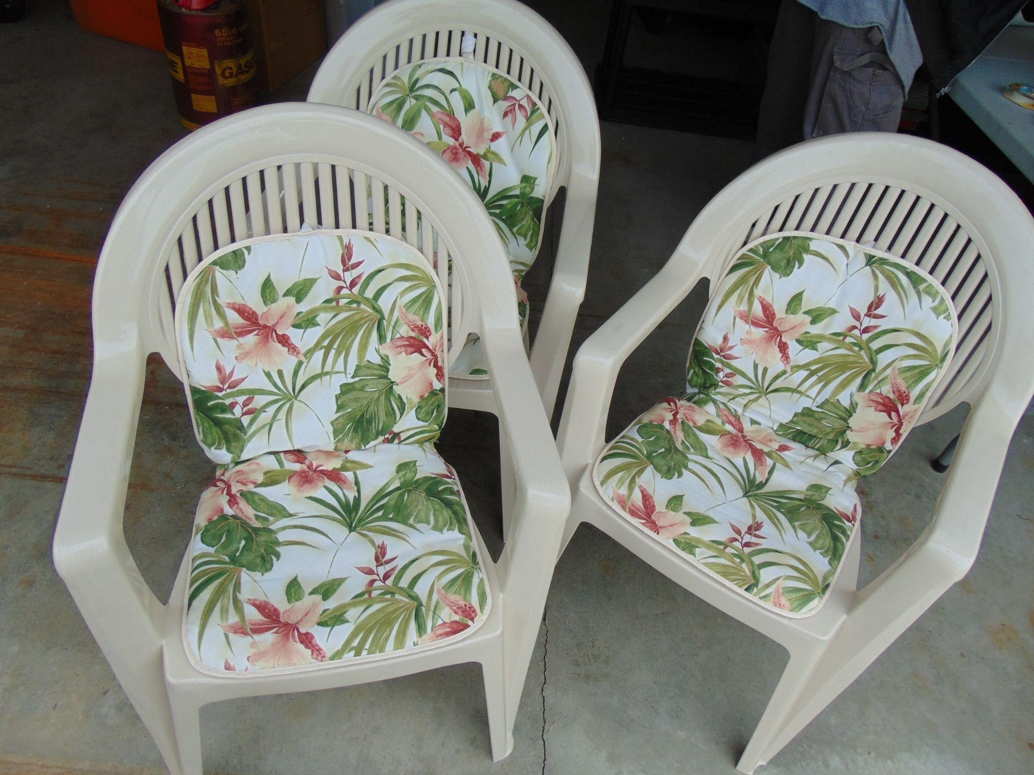 Three Plastic Chairs with Cushions