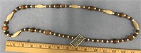 24" Long wood and fossilized ivory necklace   (a 7