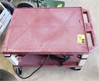 Utility cart on wheels with 120 volt cord