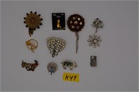 49K: (12) pins/costume jewelry