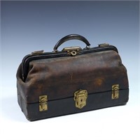 Antique leather medical doctorâ€™s bag with conten