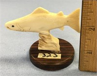 3" carving of salmon out of antler, mounted on a w