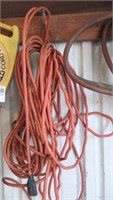 2 orange extension cords, powermate cord reel