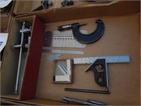 Micrometer, machinist square, caliper holder