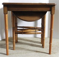 Lot #1303 - Bamboo style table with dual nesting