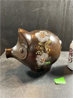 Large pottery piggy bank with chipped ear