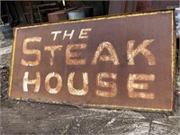 A second Steak House metal sign