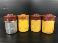 Four vintage Kodak metal film negative canisters
