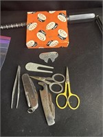 Group of sewing scissors, multiple tools, and