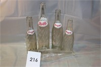 7 VINTAGE PEPSI BOTTLES