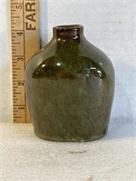 Small green pottery vase