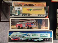 2 Hess trucks and Consolidated Freight truck