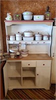 White cupboard with peg rack