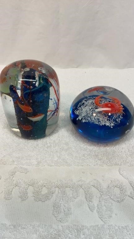 Two fish themed paperweights