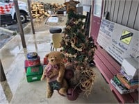 Christmas arrangement in basket with bear and such
