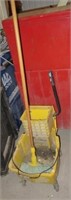 Rubbermaid mop bucket with wringer and mop.