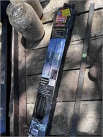 Metal pipe/birdfeeder pole.