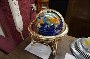 Gemstone globe on brass stand with compass