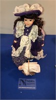 Vintage porcelain doll and mini baby doll with