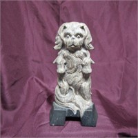 Antique cast iron standing doorstop.