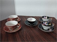 5 teacup and saucer sets. 2 dragonware, 2 Chugai