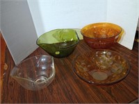 4 great MCM glass bowls. Small knick on the of one