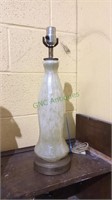 Vintage table lamp with glass and metal base.