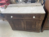 Small antique marble top buffet