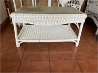 White wicker coffee table with glass top