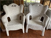 Pair of white wicker arm chairs