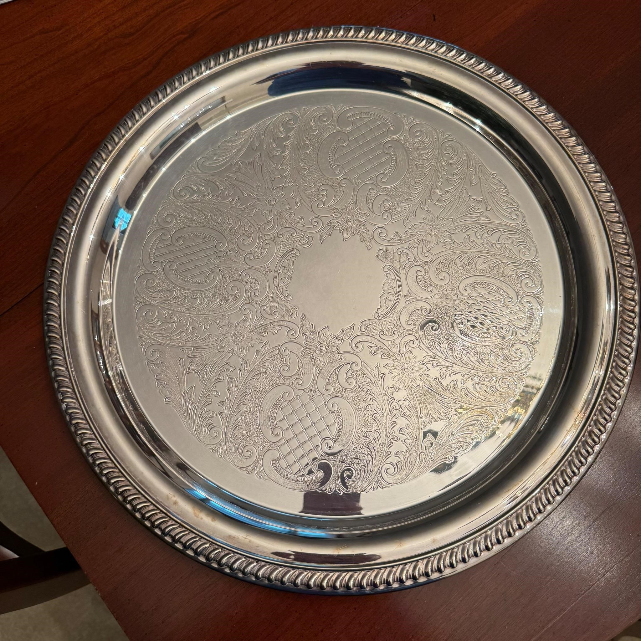 1 silver plated 16" round. See pictures.