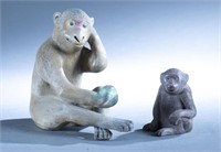 2 Chinese ceramic monkey figures.