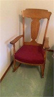 Oak cushioned wood rocking chair