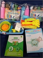 Sand toys, water blasters, child's water mat