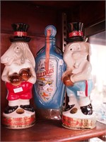 Three liquor decanters depicting