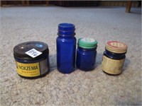 vintage blue glass jars .