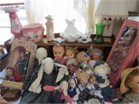 Dolls and items on head board
