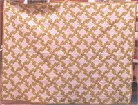 A handmade quilt, Drunkard's Path pattern,