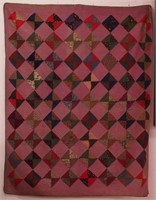 A vintage Log Cabin patchwork quilt