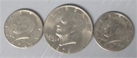 Eisenhower Dollar and (2) Kennedy Half Dollars in